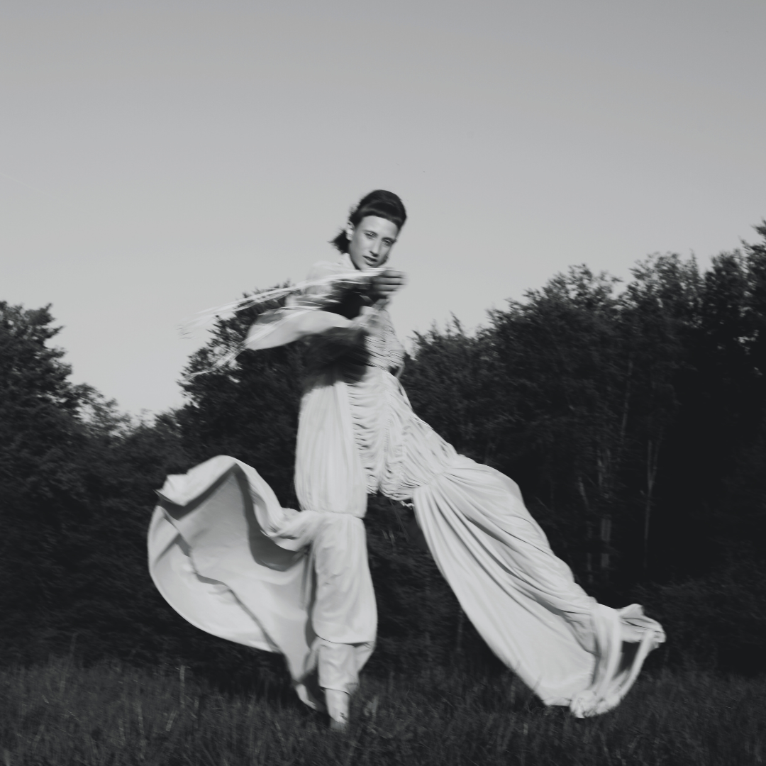 Woman dancing outside black and white, fashion