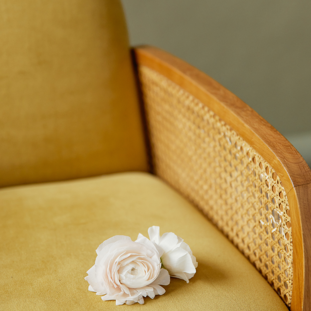 yellow chair with white rose